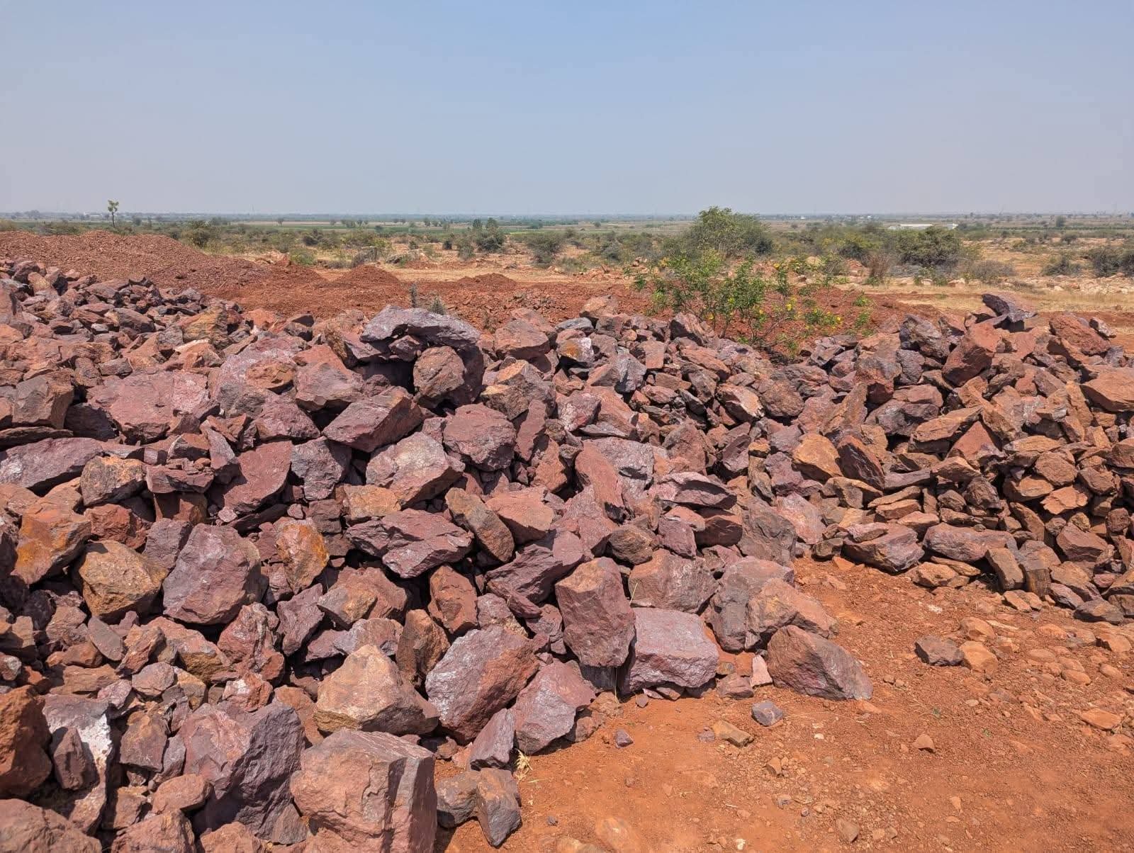 Iron ore and laterite lump stockpiles at an Alham Exim partner mine head