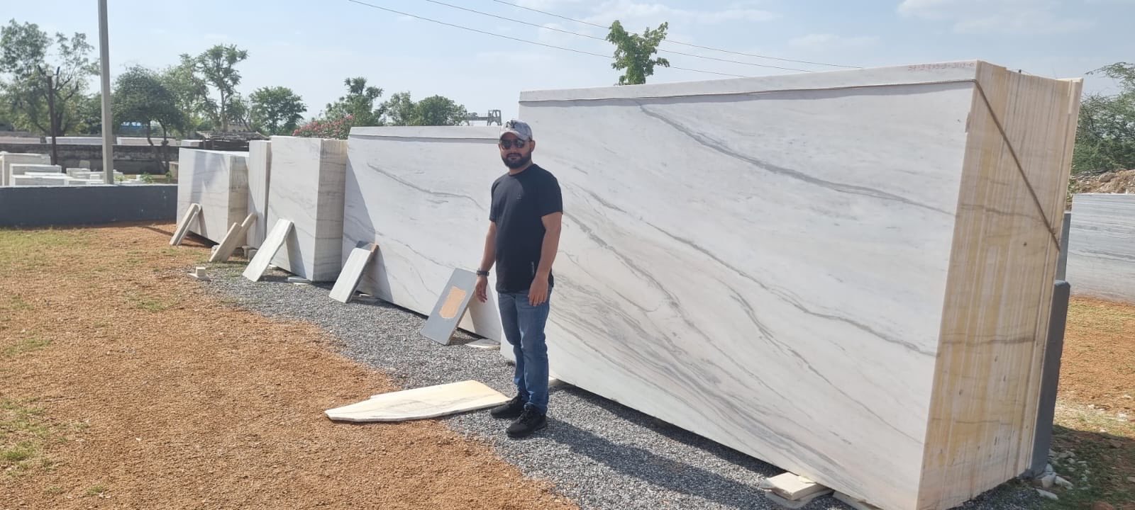Founder reviewing export slab inventory at stockyard