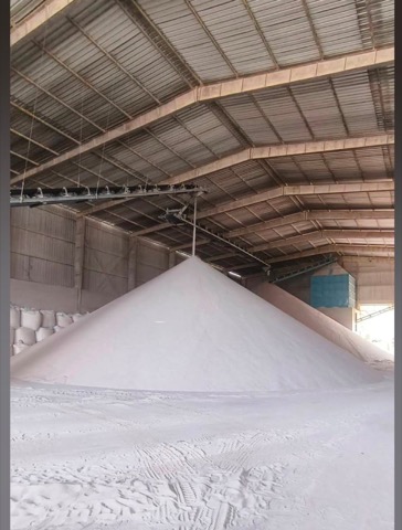 Covered warehouse storage of processed mineral sand